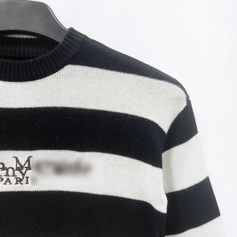 मेरिनो वूल स्वेटर स्वेटर कंपनी बनाती है